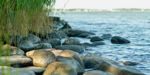 Fototapeta na wymiar rocky shore of the lake, close up
