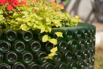 Eco-friendly disposal of used glass containers. Landscape design. A fragment of a circular...