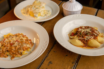 dishes with different italian pasta and types of sauce