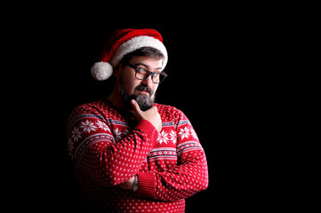 Thinking portrait of a man in santa hat