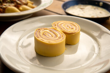 Italian pasta rondelli with ham and cheese