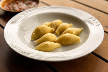 Naklejka na ściany i meble Italian pasta conchiglione without sauce