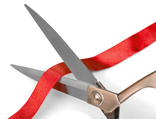 Scissors ribbon cutting red ribbon closeup isolated close-up