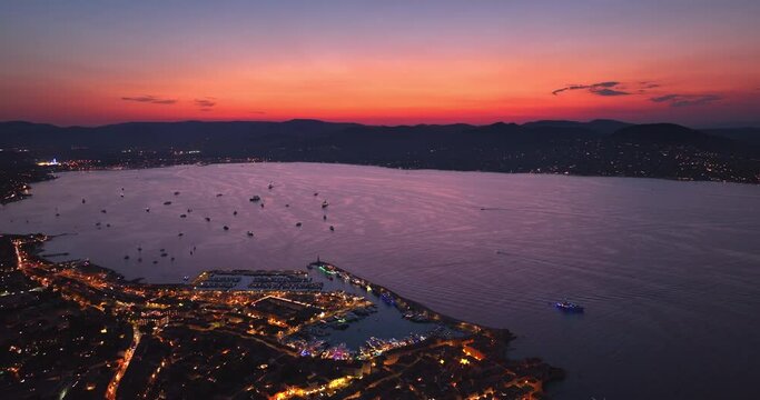 Aerial view of Saint-Tropez during sunset. St. Drone flies over the harbor of France Mediterranean Azur.