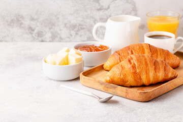Hot coffee, croissants on a light background, selective focus.