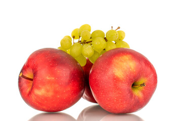 Naklejka na ściany i meble Two red apples and grapes, macro, isolated on white background.