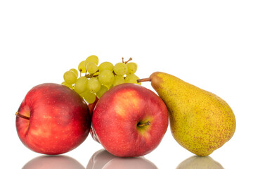 Two red apples, pear and grapes, macro, isolated on white background.