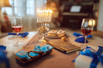 Close up of cookies at dining table during Hanukkah celebration.