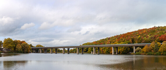 Fototapeta na wymiar Panoramic autumn photo of the german autobahn bridge on the Seilersee lake in Iserlohn in the Sauerland, NRW