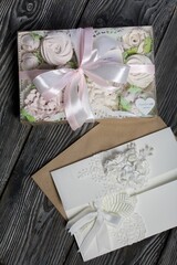 Homemade marshmallows in a gift box. Tied with ribbon. Zephyr flowers. Homemade greeting card in white. With decorative elements. Ribbons, flowers and leaves are attached to cardboard.
