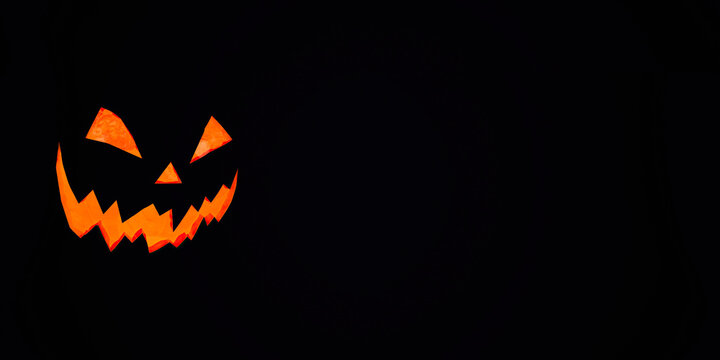 Halloween pumpkin with scary face on black background, 3d render, logo