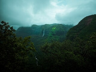 Beautiful shot of green mountains in the foggy weather