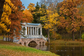Marble bridge in the autumn park in the city of Pushkin near St. Petersburg
