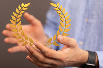 winner honer prize in hand