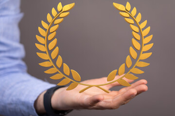 winner honer prize in hand