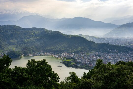 Aerial view of Phewa lake and the Annapurna Himalaya Mountain Range in Pokhara city, Nepal