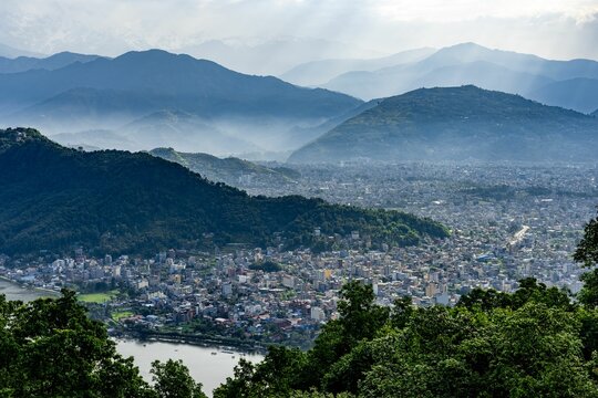 Aerial view of Phewa lake and the Annapurna Himalaya Mountain Range in Pokhara city, Nepal