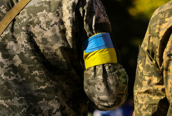 Ukrainian military with a yellow armband