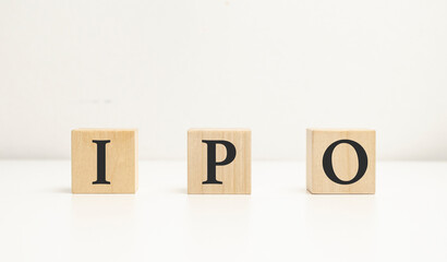 IPO word of wooden cube or block concept on wooden background.