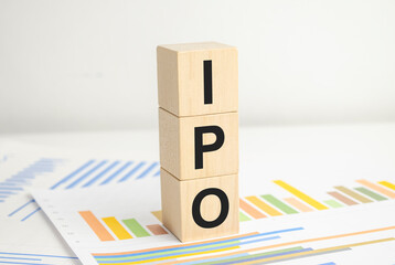 IPO word of wooden cube and charts on white background