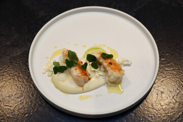 Seafood dinner with a stylishly designed plate design