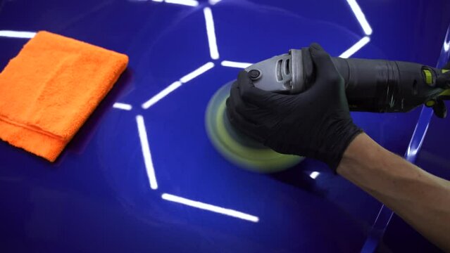 Sealant car polishing with orbital polisher for remove scratches 4k video. Worker of detailing auto service making final polishing for car.