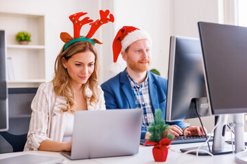 Business colleagues working at the office for Christmas
