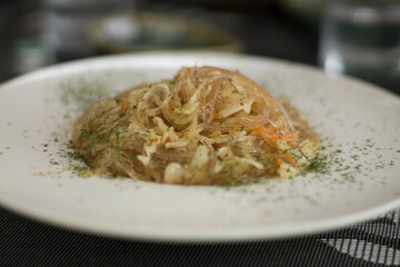 Soy noodles with vegetables, carrot, cabbage, parsley.