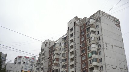Large high soviet building panoramic view from bottom to top. An old dilapidated house from the...