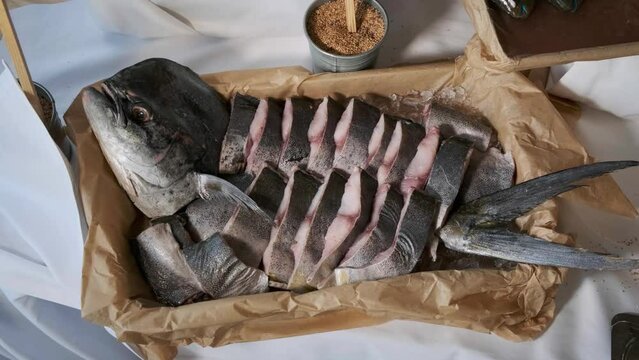 marine products. sliced scobia on a plate