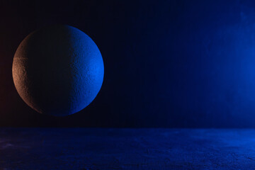Abstract space concept with model planet. Cement sphere on floor or wall geometric shape background