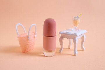 Beige nail polish bottle and mini furniture