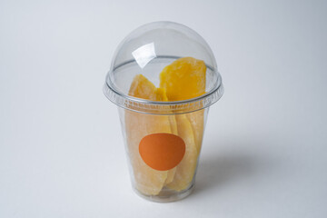 dried sliced mango in a disposable transparent sachet