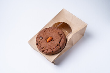 chocolate cookies with almonds on craft packaging