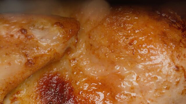 Grilled chicken is cooking in the oven. Close up of roasted chicken meat. Chicken tabaka. Gourmet food and gastronomy concept.