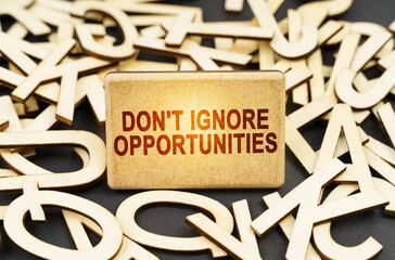 Among the wooden letters is a sign with the inscription - Don't Ignore Opportunities