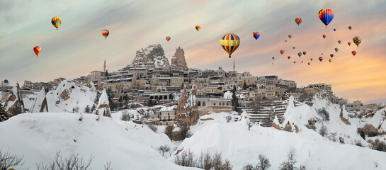 Uchisar panoramic view with balloons in Cappadocia