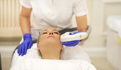 Obraz premium Photorejuvenation,Cosmetic Laser Dermatology ,dermatologist offices,laser technology.