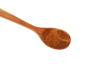 Natural Coconut palm sugar in wooden spoon on white background, top view. Design element. Selective focus, close-up. Coco Brown granular sugar