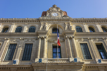Fototapeta na wymiar Cannes' imposing four-stores Town Hall (Hotel de Ville, 1876) at sunset. Cannes, France.