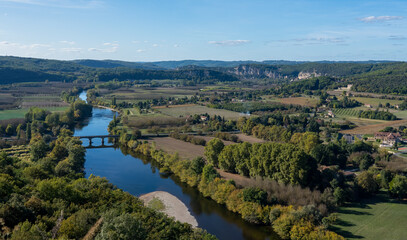 Fototapeta na wymiar view along the Dordogne river and scenic countryside from high in the Castelnaud-la-Chapelle Chateau, blue sky