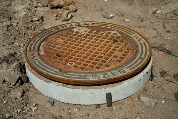 Closeup shot of a rusty sewer hatch