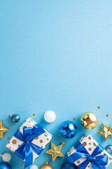 Christmas Day concept. Top view vertical photo of white blue and gold baubles gift boxes with...