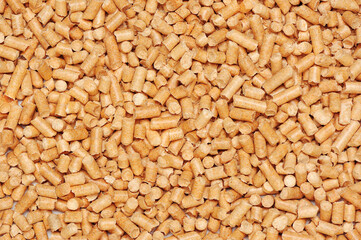 Background with wooden pellets close-up