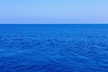 View of the open sea from the yacht. Background with selective focus
