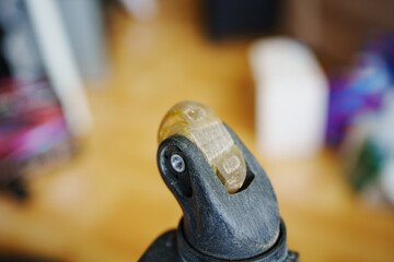 an old dirty broken wheel from a black travel suitcase. 