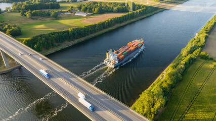 Cargo ships and motorway bridge. Traffic on the A 7 federal motorway and Kiel Canal. Infrastructure...