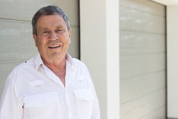 Street portrait of smiling senior man