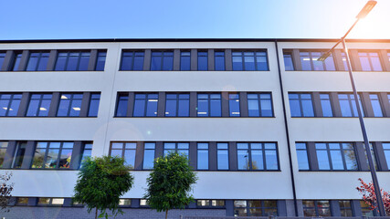 Abstract fragment of contemporary architecture, walls made of glass and concrete. Office building.