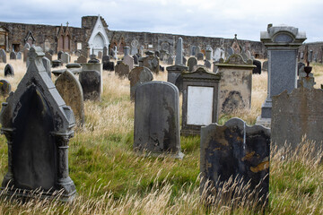 Ancient graves in the churchyard of Saint Andrews Cathedral in Scotland